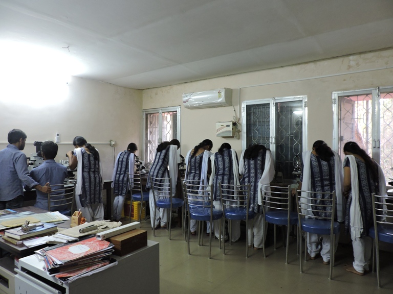 Students at hands on practical in Microscope Laboratory